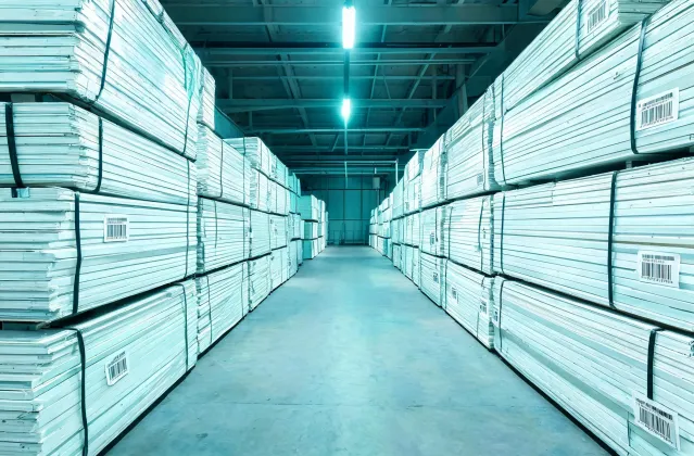 Recyclable PVC panel stack at a Trusscore distribution yard